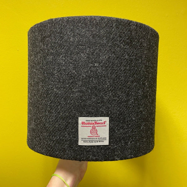 Charcoal Grey Harris Tweed Shade - 25cm Drum Shape against a yellow background.